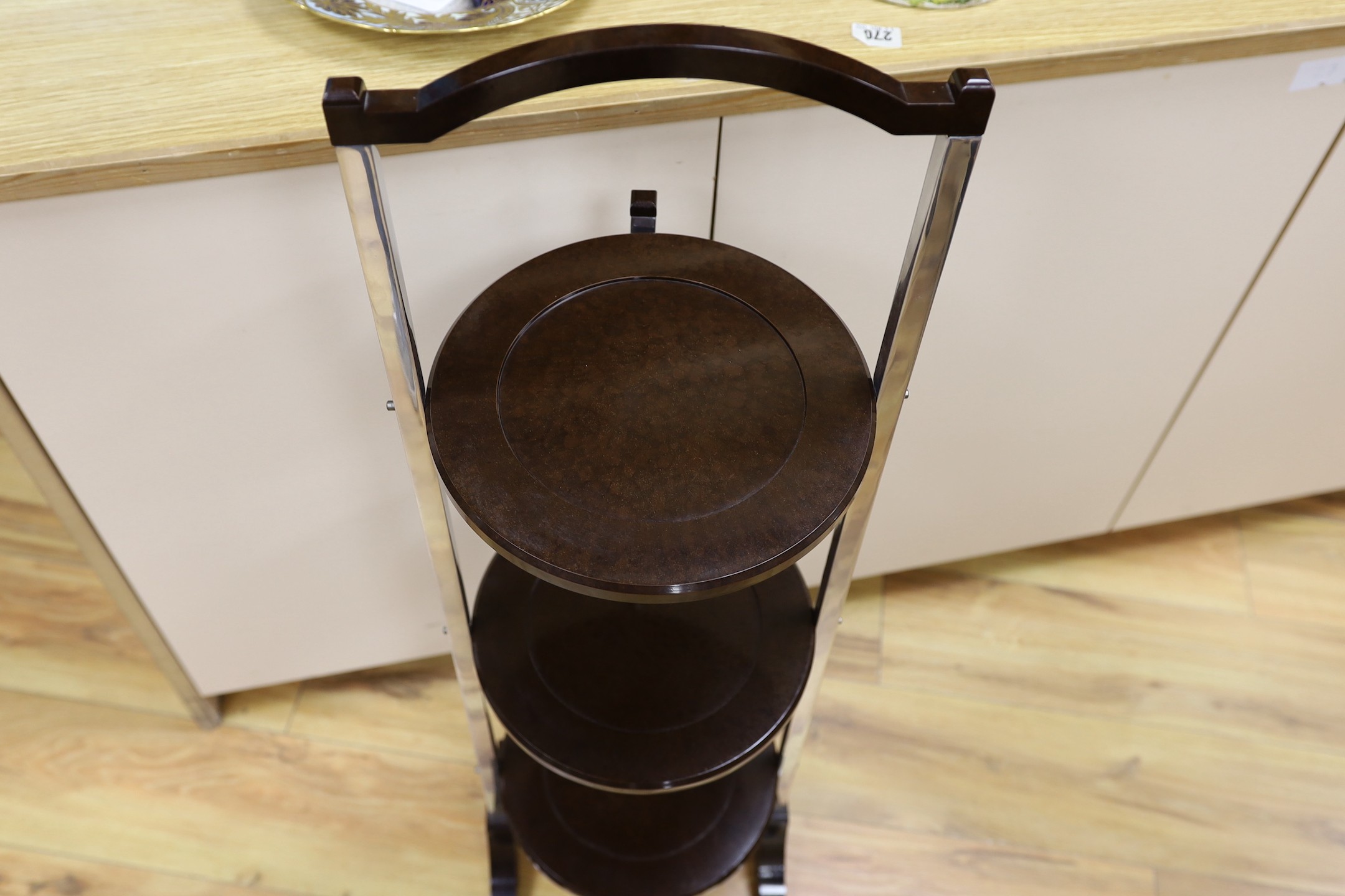 A Bakelite and chrome cake stand, 93cm
